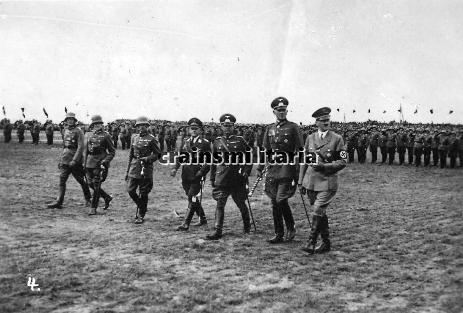 Adolf Hitler, joined by several generals and staff officers, during the parade of the V. Armeekorps in Giebelstadt, near Würzburg